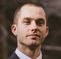 Thomas Whitfield, analista di trading ed esperto di mercato crypto, headshot.
